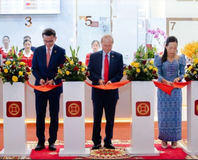 Ribbon Cutting Ceremony, presided over by Lok Neak Okhna Dr. Pung Kheav Se, Chairman of Canadia Bank (center), alongside Mr. Raymond Sia, CEO (left), and Ms. Song Khenglay, COO (right).