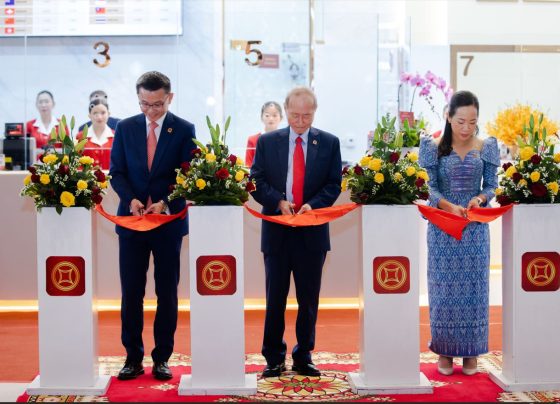 Ribbon Cutting Ceremony, presided over by Lok Neak Okhna Dr. Pung Kheav Se, Chairman of Canadia Bank (center), alongside Mr. Raymond Sia, CEO (left), and Ms. Song Khenglay, COO (right).