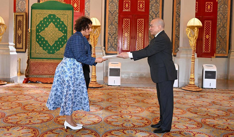 King Norodom Sihamoni (R) receives the credentials of the newly appointed Ambassador of Israel to Cambodia, Alona Fisher-Kamm, at the Royal Palace. Ministry of the Royal Palace