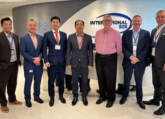 Sear Rithy (centre), founder and chairman of WorldBridge Group, at a partnership announcement highlighting efforts to strengthen world-class health and security services in Cambodia. WorldBridge Group