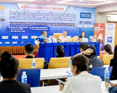 Sem Phalla (left) and Vath Chamroeun address a press conference at the headquarters of the National Olympic Committee of Cambodia on April 28. NOCC