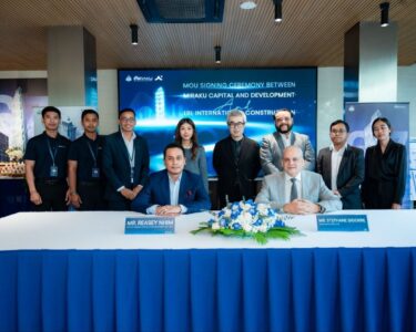 Mr. Reasey Nhim of MIRAKU Capital & Development and Mr. Stephane Bigorre of LBL International Construction during the official signing ceremony for the G.A.T.O Tower project in Phnom Penh ahead of its June 2026 groundbreaking.