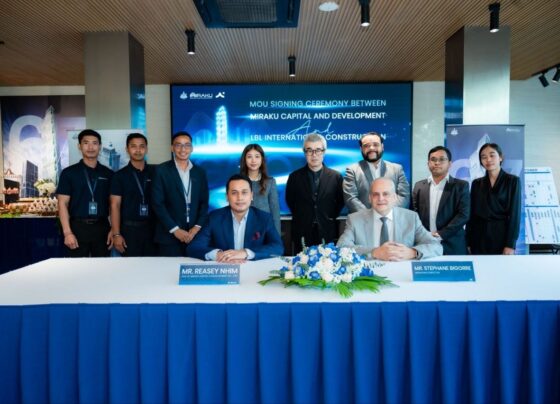 Mr. Reasey Nhim of MIRAKU Capital & Development and Mr. Stephane Bigorre of LBL International Construction during the official signing ceremony for the G.A.T.O Tower project in Phnom Penh ahead of its June 2026 groundbreaking.
