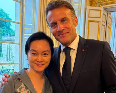 Oknha Dr. Carolyne Pung exchanged with French President Emmanuel Macron at the Élysée Palace alongside international business leaders.