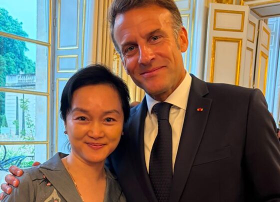 Oknha Dr. Carolyne Pung exchanged with French President Emmanuel Macron at the Élysée Palace alongside international business leaders.